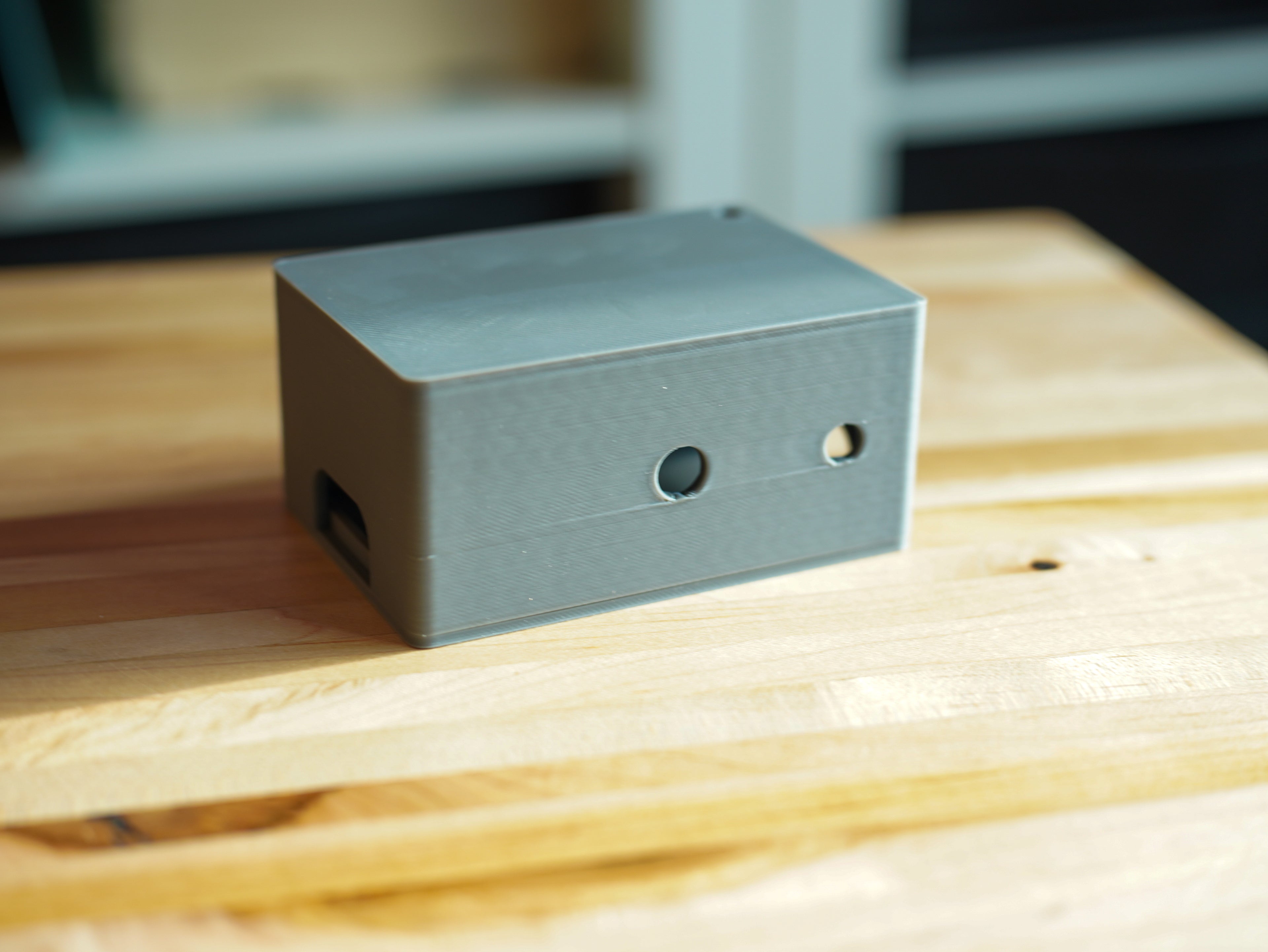 Small plastic box on a wooden surface
