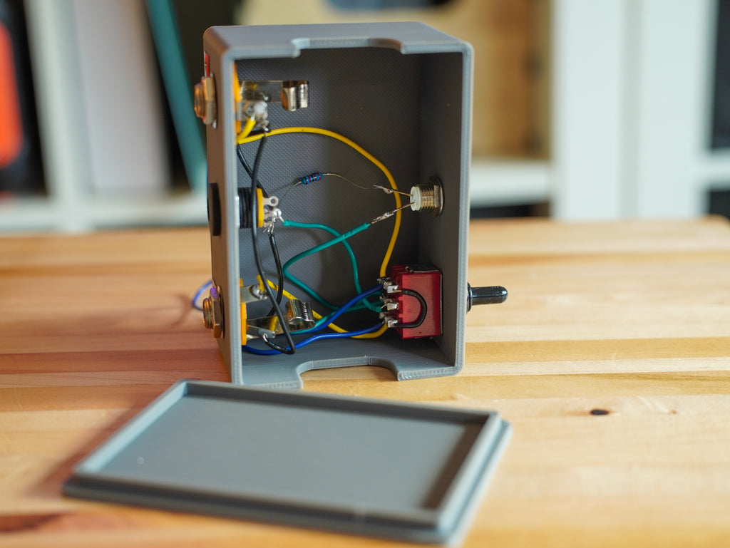 Electrical box with wires on a wooden surface